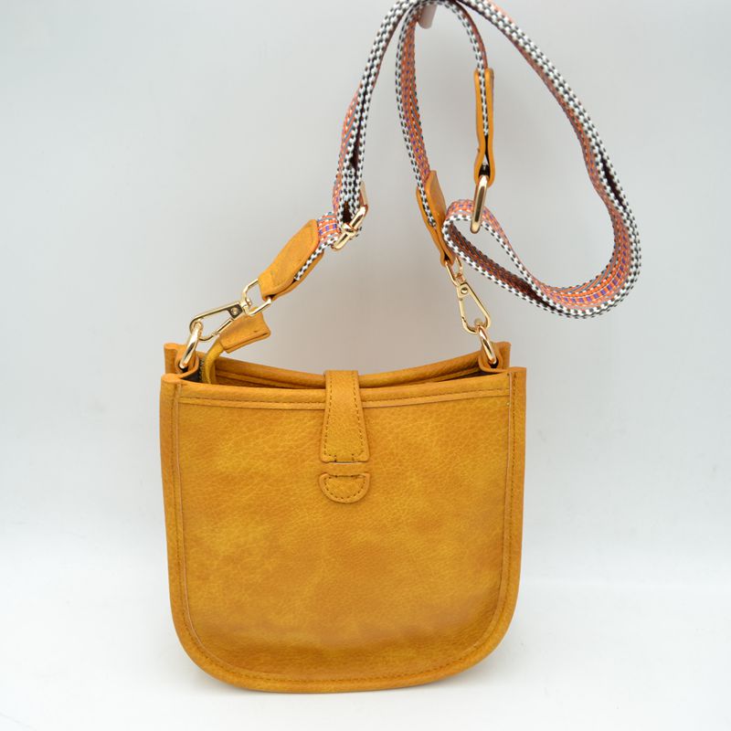 Minimalist Curved Crossbody Bag with Patterned Guitar Strap