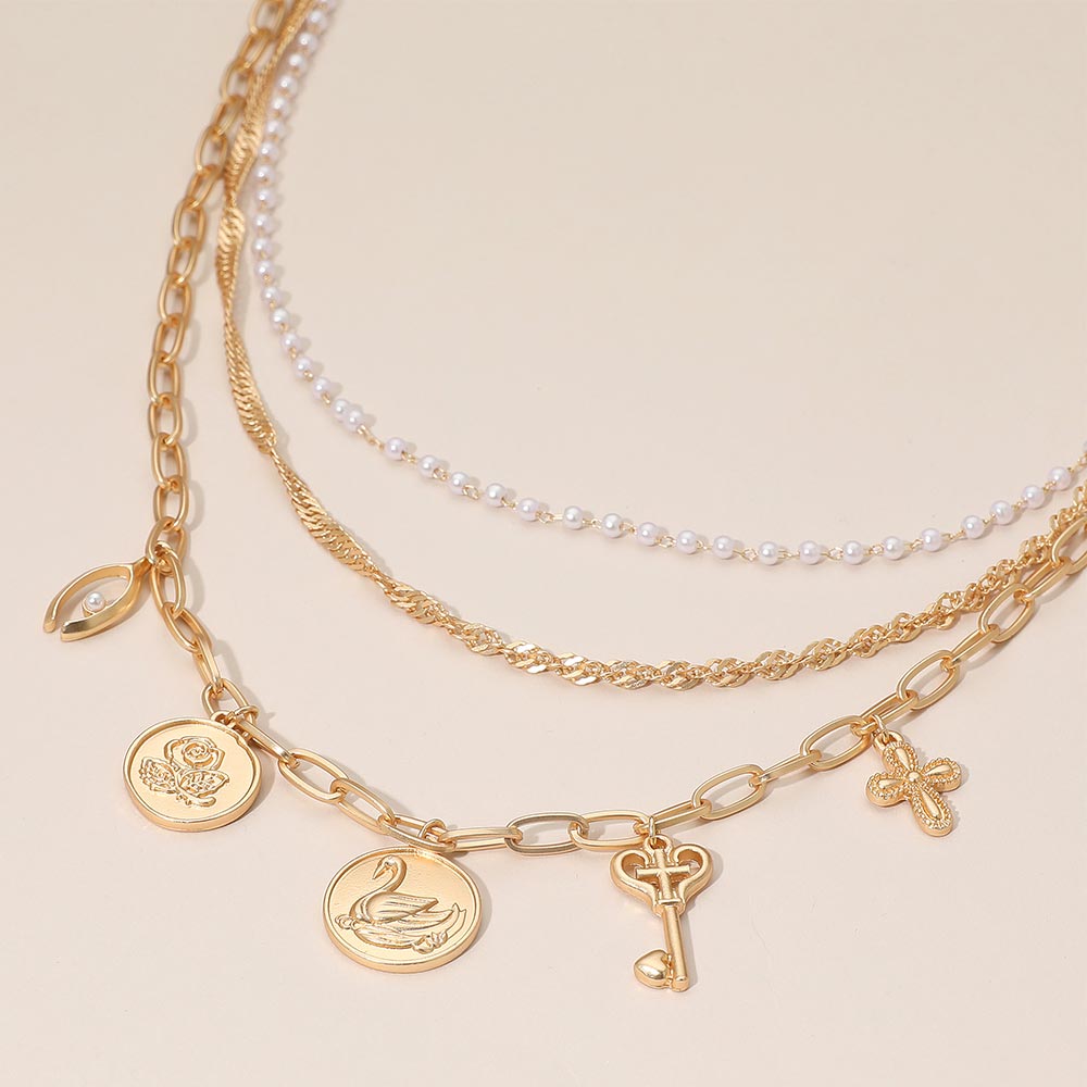 Flower Swan Embossed Medallion Key Cross Pearl Charm Station Layered Chain Necklace