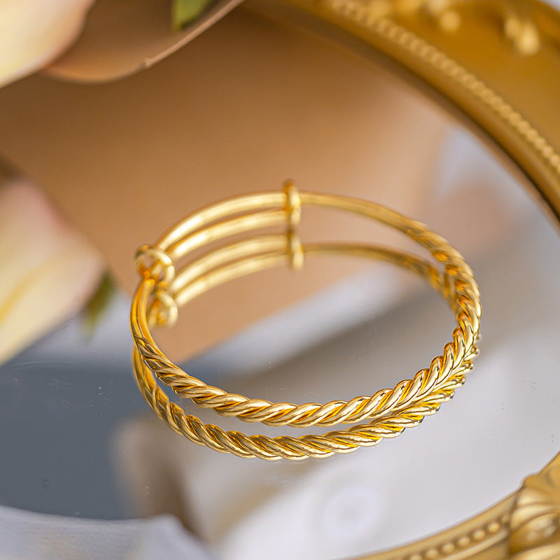 Polished Surface Twist Push-pull Alluvial Gold Bracelet