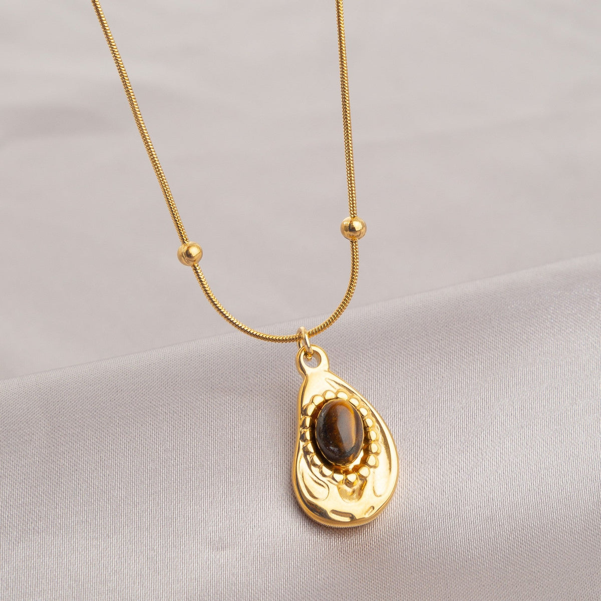 Retro Irregular Tigereye Titanium Steel Female Light Luxury Minority Pendants