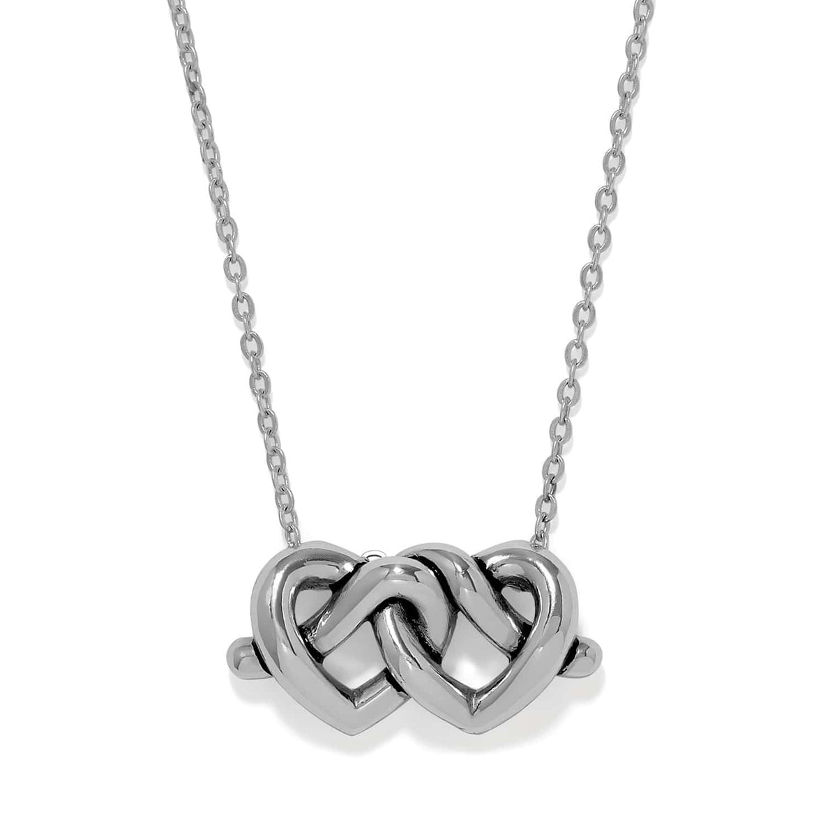 Brighton pendant necklace with two interlocking silver-plated hearts on a delicate chain on a white background