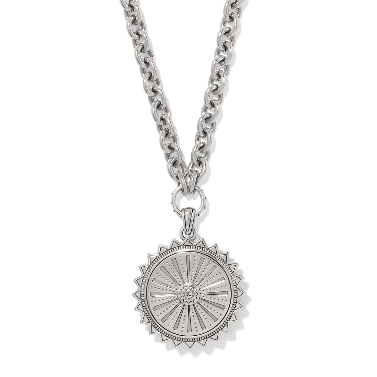 Brighton pendant necklace with silver-tone sunburst medallion, crystal center, and chunky cable chain on a white background