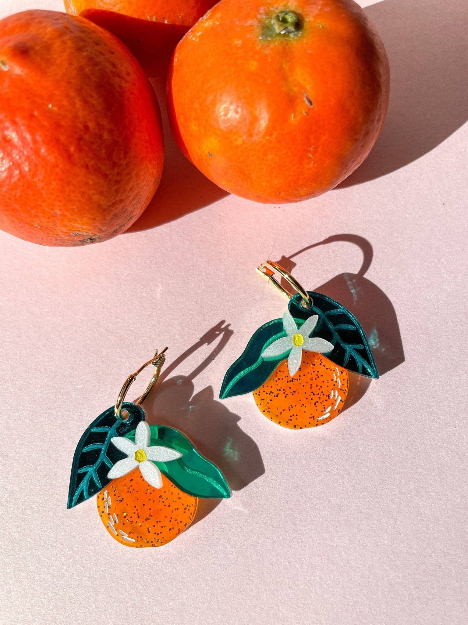 Orange Dangle Earrings by Quirks! at Shirley Shoppe