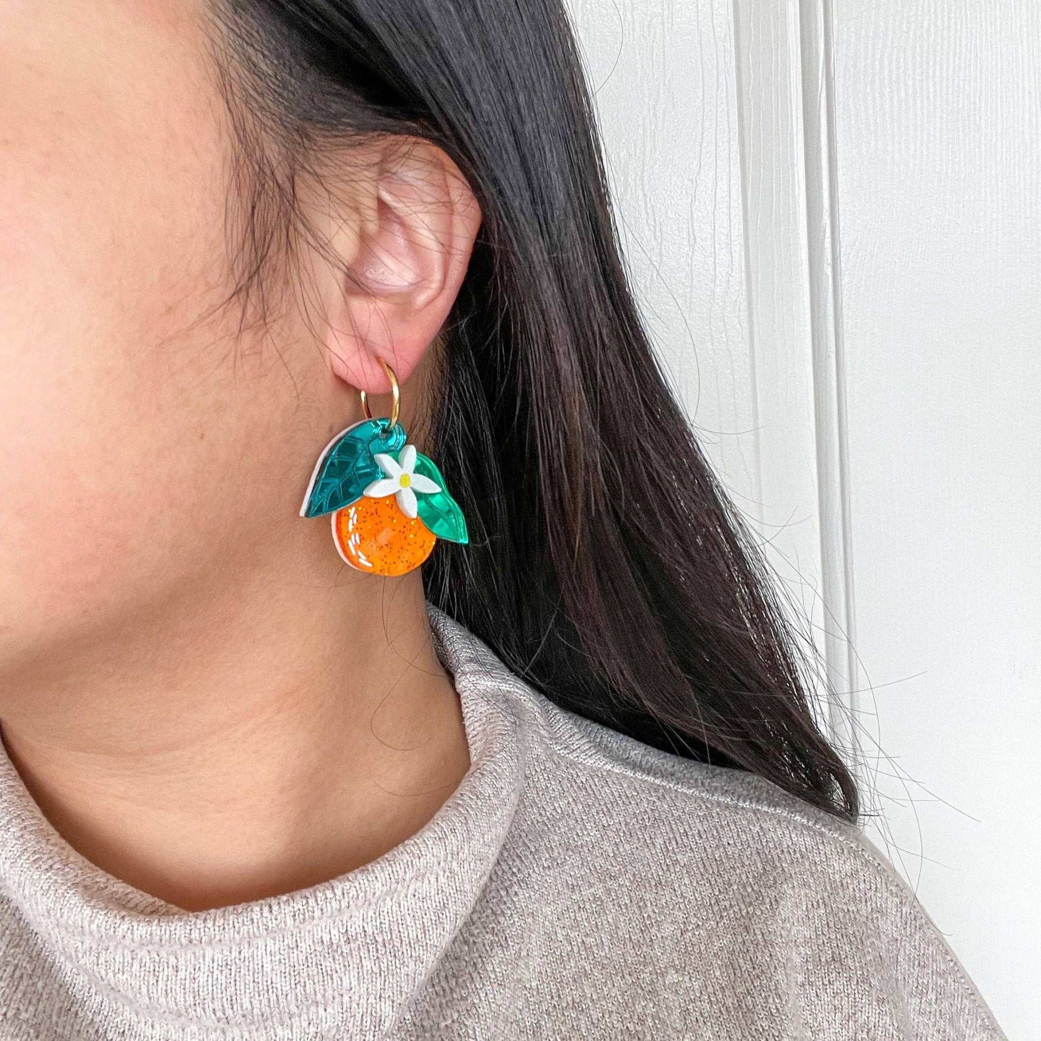 Orange Dangle Earrings by Quirks! at Shirley Shoppe
