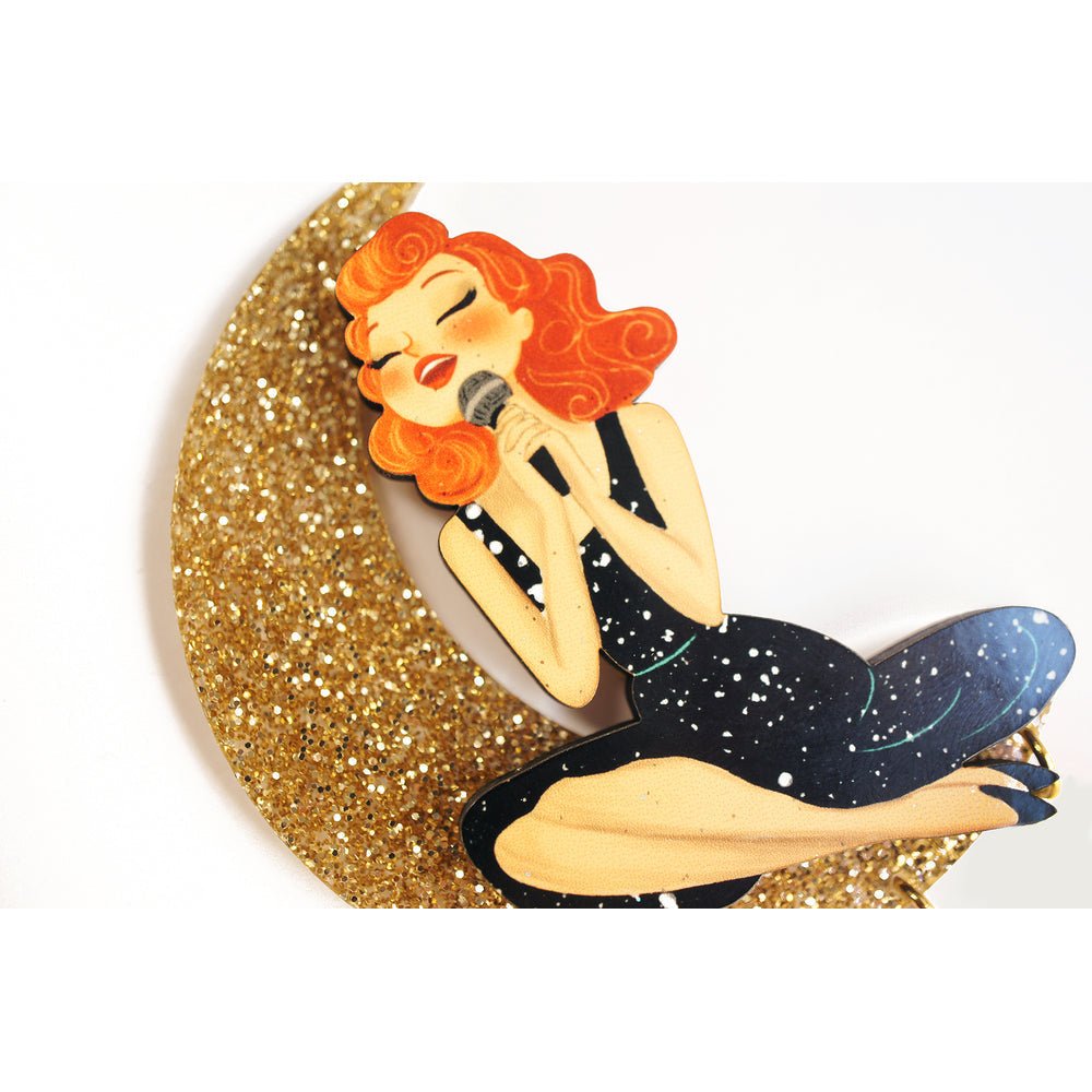 Singer sitting on the Moon Brooch by Laliblue by Quirks! at Shirley Shoppe